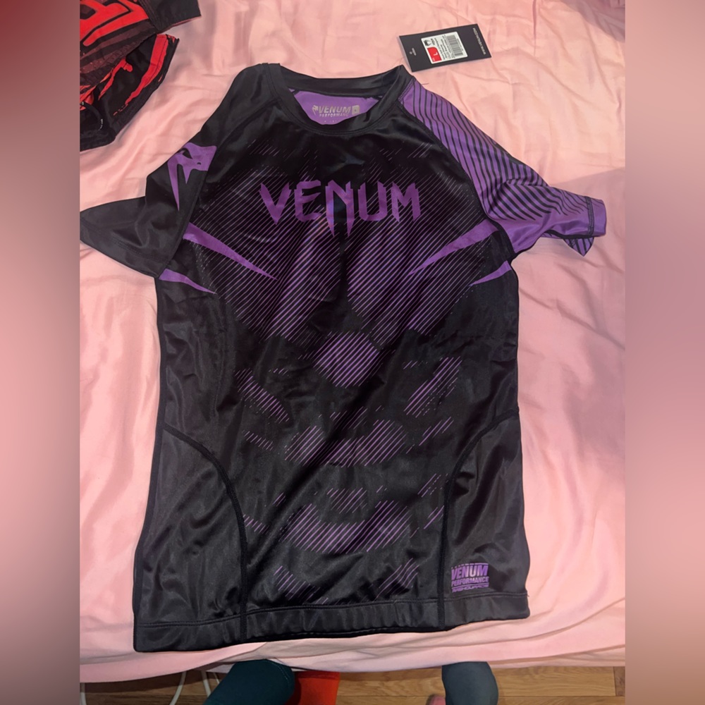 Black and purple VENUM UFC short sleeve rashguard